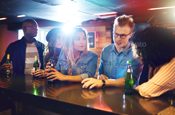 Friends having the drinks in the bar Stock Photo by UberImages | PhotoDune