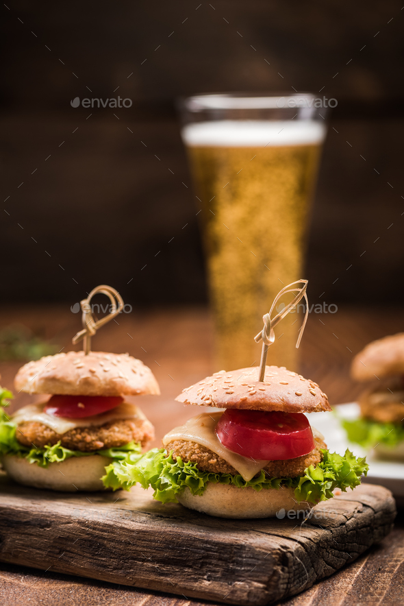 Chicken burgers served with beer in pub Stock Photo by merc67 | PhotoDune