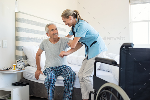 Nurse helping old patient get up Stock Photo by Rido81 | PhotoDune
