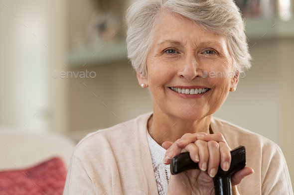 Elderly woman smiling at home Stock Photo by Rido81