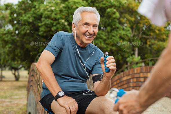 Old man exercising using hand gripper
