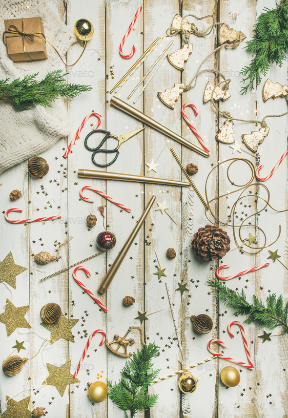Flat-lay pattern of holiday decoration objects, toys, candles, winter sweater - Stock Photo - Images