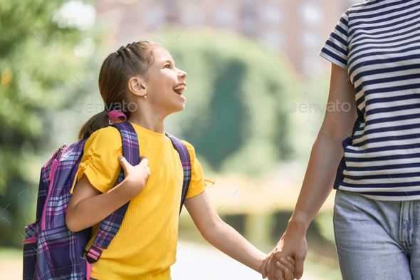 Parent and pupil go to school - Stock Photo - Images