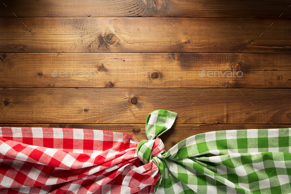 checked tablecloth at wooden table - Stock Photo - Images