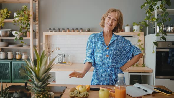 beautiful senior woman in her  apartment alt