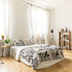 An interior of a bedroom with herringbone parquet, white walls a - $5.00 An interior of a bedroom with herringbone parquet, white walls a