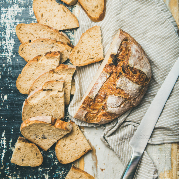 Sourdough wheat bread loaf cut in slices, square crop - Stock Photo - Images