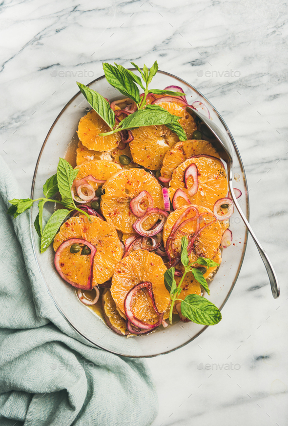 Flat-lay of orange, pickled onion and caper salad - Stock Photo - Images