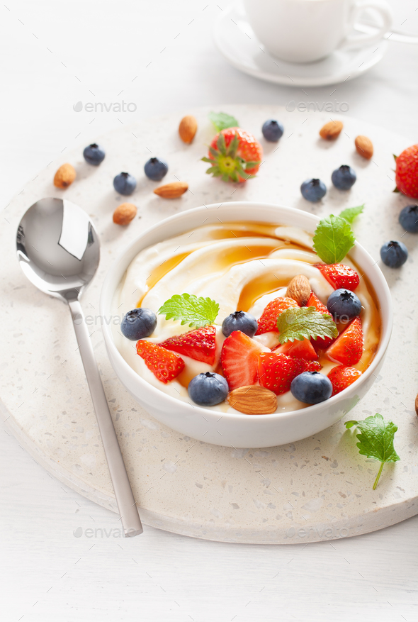 yogurt with strawberry blueberry honey almond for breakfast Stock Photo by duskbabe