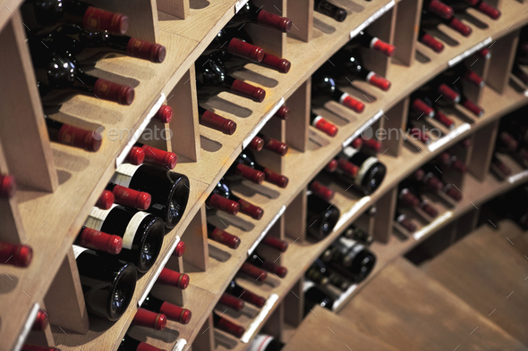 Downstairs and wine bottles in a winery Stock Photo by Jacques_Palut