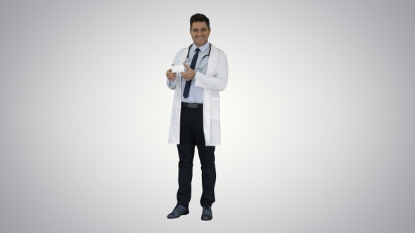 Doctor Presenting Vitamins and Talking About Them to Camera alt