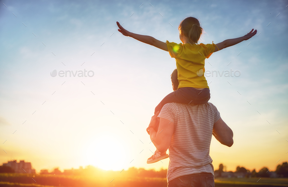family at sunset - Stock Photo - Images