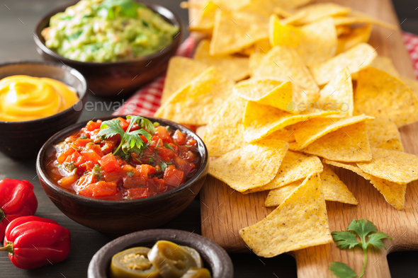 mexican nachos tortilla chips with guacamole, salsa and cheese d Stock ...