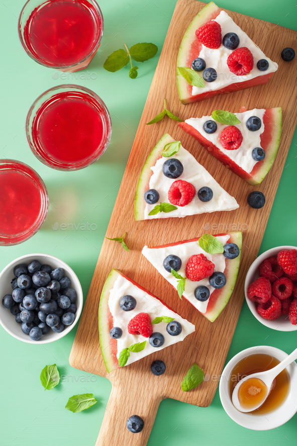 watermelon pizza slices with yogurt and berries, summer dessert Stock Photo by duskbabe