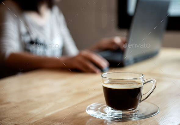 Coffee On Wooden Table With Blurred Office Girl Background Stock Photo By Poungsaed Eco