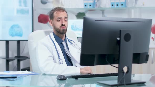 Scientist Having a Video Call in His Modern Research Center alt
