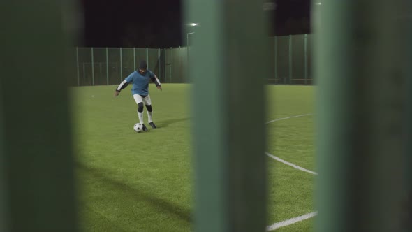 Man Training on Soccer Field Alone alt
