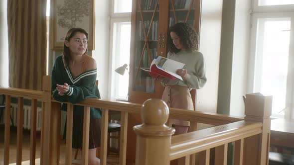 Education Stock Footage 4 K Ultra Hd Clips   A Woman Leaning On A Wooden Railing alt