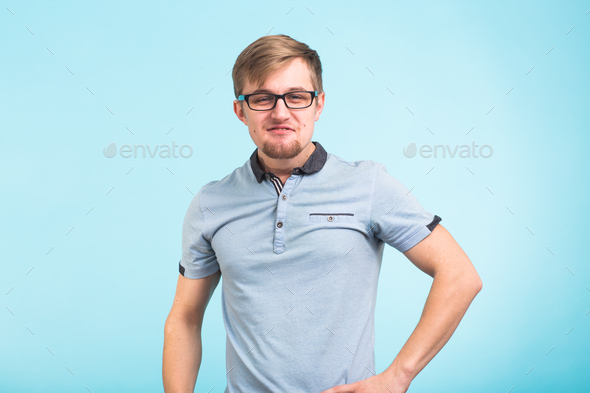 Arrogant bold self important stuck up man over blue background Stock Photo by Satura_