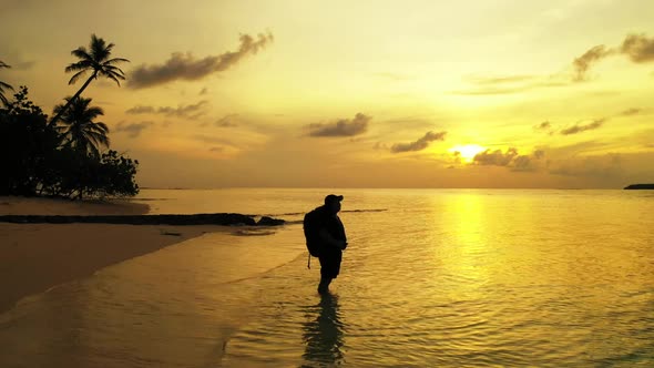 Lady happy and smiling on marine resort beach holiday by blue sea with bright sandy background of th alt
