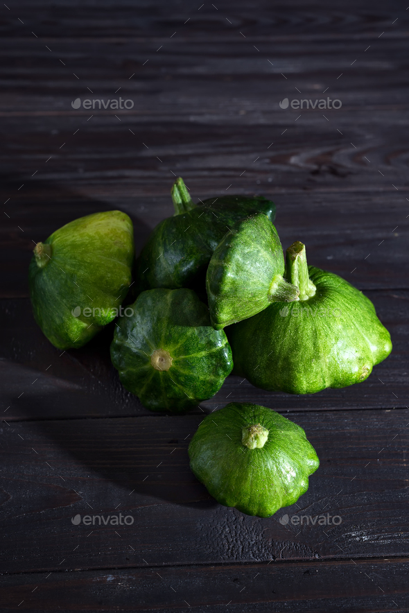 small size patty pan patisson squash on dark wooden background with copy space Stock Photo by lyulkamazur
