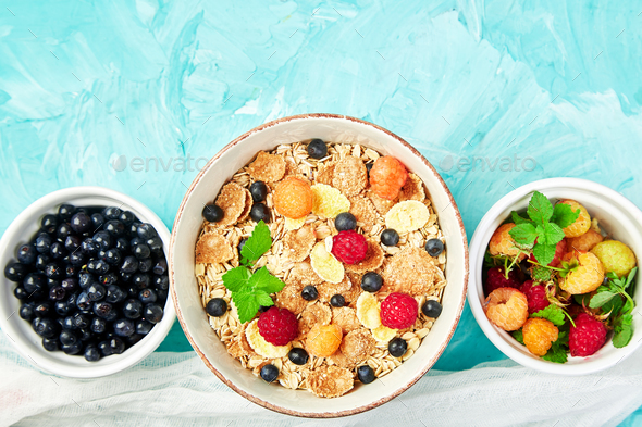 Healthy vegetarian breakfast. Oatmeal, granola with raspberries