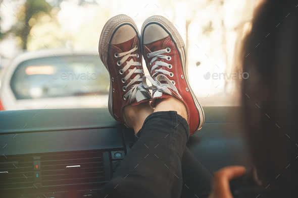 Modern woman tourist, photographer relaxing in the car holding a Stock Photo by arthurhidden