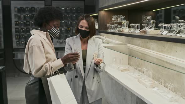 Women in Masks in Jewelry Store alt