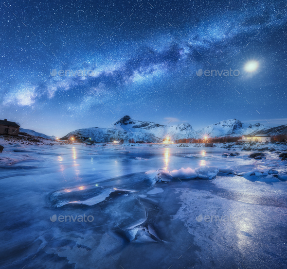 Milky Way above frozen sea coast, snow covered mountains - Stock Photo - Images