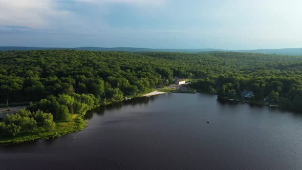 Lush Greenery Surrounding Lake Tahoe In Nevada State, USA - aerial shot alt