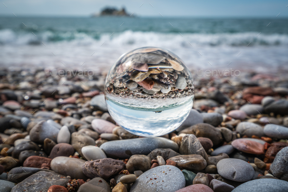 Beach peebles reflected in a galss ball Stock Photo by pawopa3336 | PhotoDune