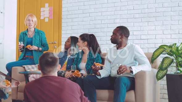 Friends in the Room Sit and Talk, Tell Their Interesting Stories About Each Other alt