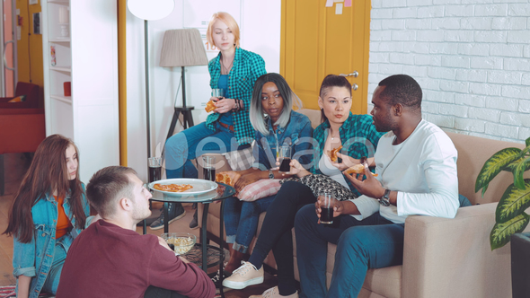 Friends in the Room Sit and Talk, Tell Their Interesting Stories About Each Other alt