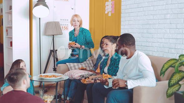 International Company of Friends Sits Next To Each Other and Communicate alt