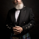mature male model wearing kilt with grey hairstyle and beard - PhotoDune Item for Sale