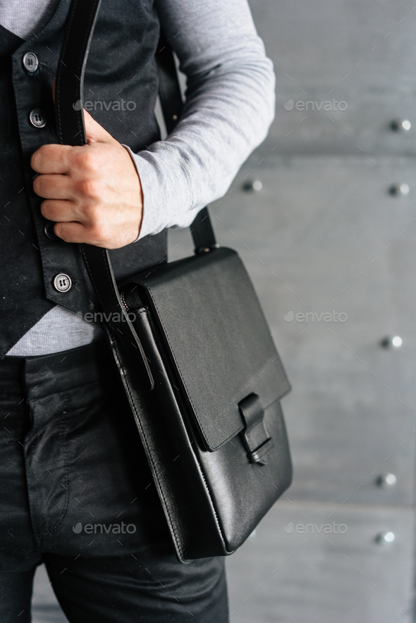 handsome guy with leather bag Stock Photo by simbiothy | PhotoDune