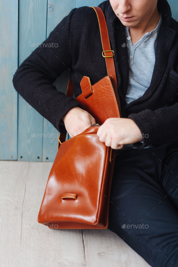 handsome guy with leather bag Stock Photo by simbiothy | PhotoDune