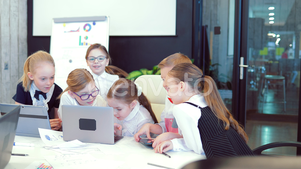 Meeting of Business Children in a Modern Office alt