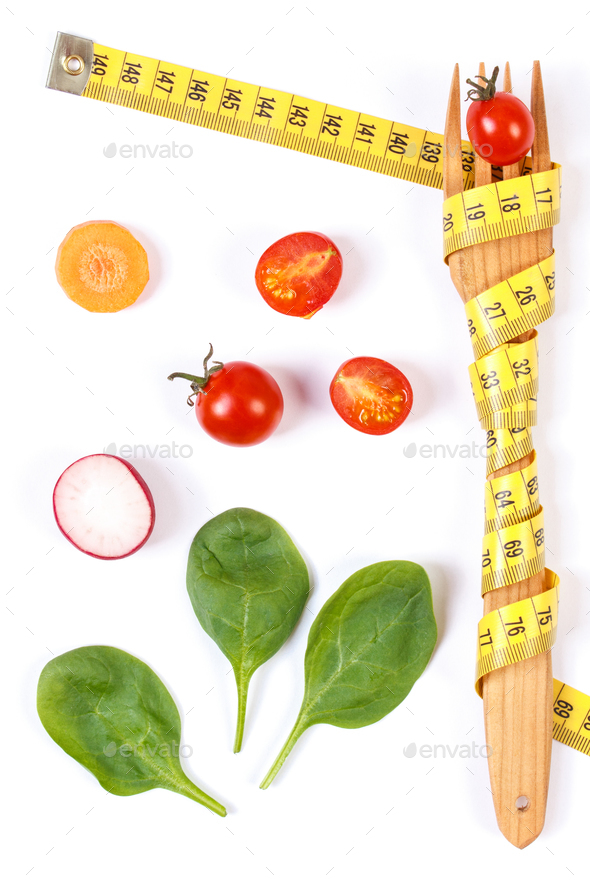 Fork wrapped in centimeter and fresh vegetables, concept of lose weight and healthy nutrition - Stock Photo - Images