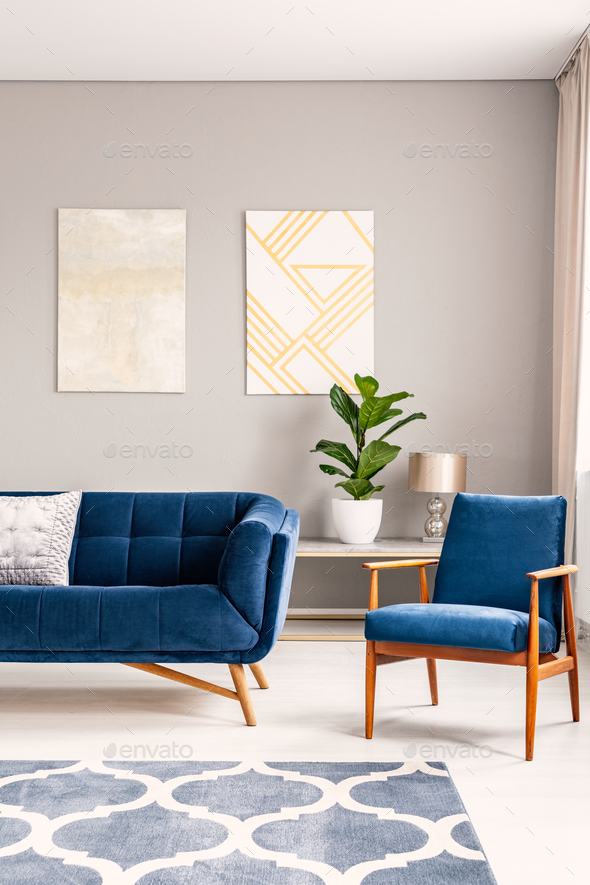 Two modern art paintings hanging on wall in real photo of bright Stock Photo by bialasiewicz