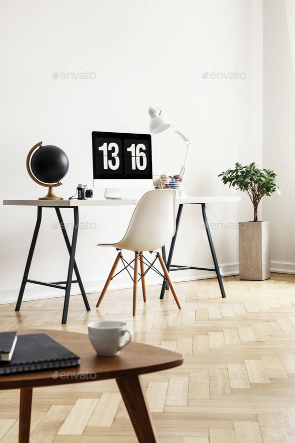 Real photo of a coffee table with notebooks and cup with a desk, Stock Photo by bialasiewicz