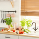 Countertop with bread on wooden board, fresh tomatoes and green - $5.00 Countertop with bread on wooden board, fresh tomatoes and green
