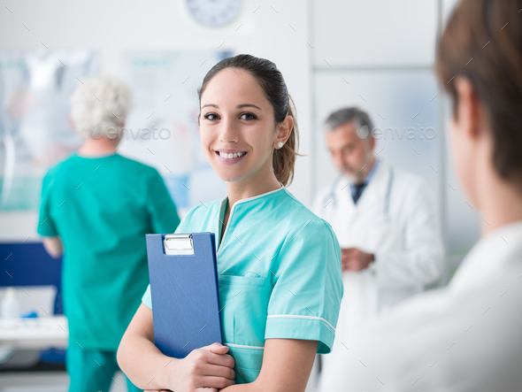 Young nurse working at the hospital - Stock Photo - Images