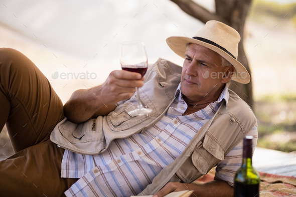 Man having wine in cottage Man having wine in cottage