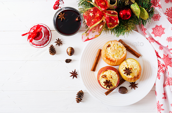 Stuffed baked apples with cottage cheese, raisins and almonds for Christmas - Stock Photo - Images