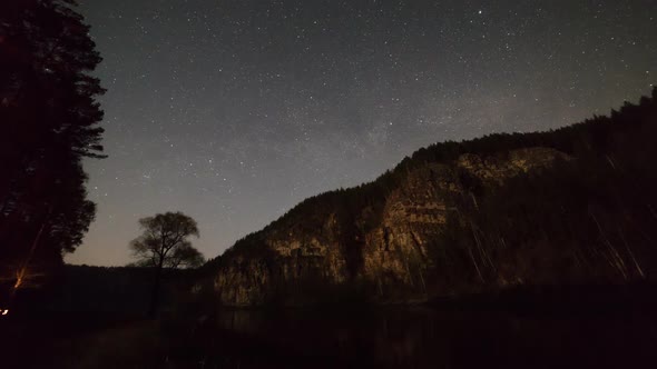 Beautiful Night Sky Full of Moving Stars - Mountain with a Forest alt