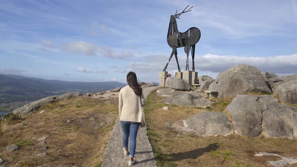 Woman walking near Cervo viewpoint in Vila Nova de Cerveira with beautiful landscape view alt