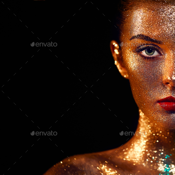 Portrait of beautiful woman with sparkles on her face - Stock Photo - Images
