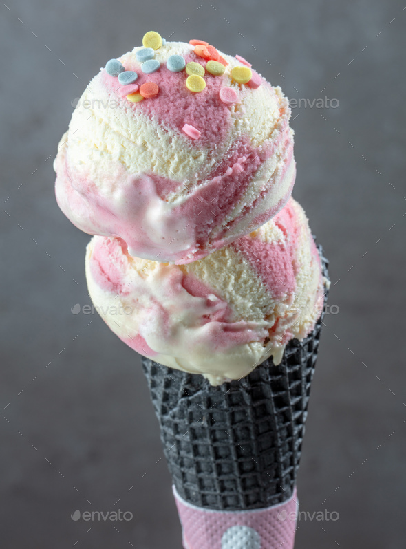 Ice cream ball with strawberry pieces Stock Photo by magone