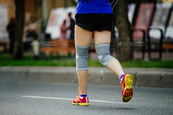 woman runner with knee pads